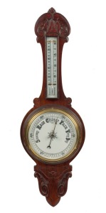 An antique aneroid banjo barometer in timber case, 19th century, 82cm high.
