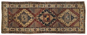 An antique hand-knotted tribal rug, 19th/20th century, ​​​​​​​337 x 132cm