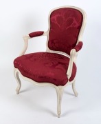 LOUIS VXI&nbsp;bergere with burgundy upholstery and milk-painted finish, 18th century, 86cm high, 60cm across the arms