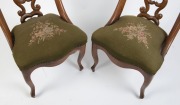 A set of four antique carved walnut salon chairs with French cabriole legs and green floral tapestry upholstery, mid 19th century, 82cm high - 7