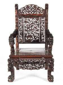A Chinese hardwood throne chair, intricately carved with various animals and dragons, early 20th century, 109cm high, 62cm wide