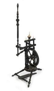 An antique German parlour spinning wheel, turned ebonized timber adorned with turned and carved ivory fittings, mid 19th century, ​​​​​​​102cm high