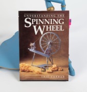 An antique Swedish spinning wheel with blue painted finish, 19th century. Featured on the front cover of "UNDERSTANDING THE SPINNING WHEEL" by Eric Corran. 100cm high - 2