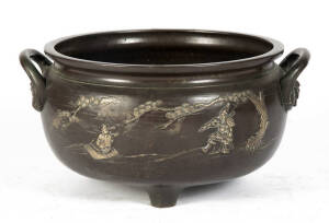 A large Japanese bronze two-handle censer, cast with mythical scenes, 1st half 20th century, 30cm high, 50cm diameter