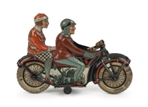 A vintage German tin plate clockwork motorcycle toy, circa 1930, 16.5cm high