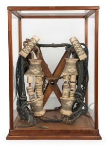 Ainu traditional horse headdress, bone, wood and natural fibre, housed in a spruce and glass display cabinet, Northern Japanese origin, Meiji period, 19th/20th century, the case 56cm high 55cm high, 40cm wide, 35cm deep