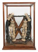 Ainu traditional horse headdress, bone, wood and natural fibre, housed in a spruce and glass display cabinet, Northern Japanese origin, Meiji period, 19th/20th century, the case 56cm high 55cm high, 40cm wide, 35cm deep