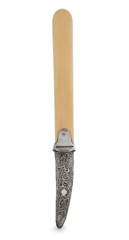 An antique page turner with ivory blade and sterling silver handle, by Crisford & Norris of Birmingham, circa 1899, ​​​​​​​42.5cm long