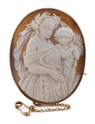 An antique 9ct gold mounted cameo brooch with unusual mother and child harvest scene, 19th century, 5cm high overall