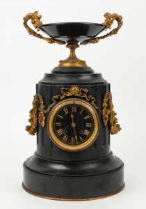An antique French urn shaped mantel clock, black slate with ormolu mounts, eight day time and strike movement with Roman numerals, 19th century, 39cm high