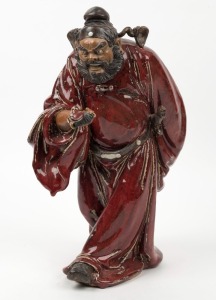 A Chinese pottery statue of a man with a fan, A/F, 20th century, ​​​​​​​38cm high