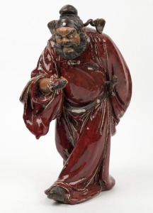 A Chinese pottery statue of a man with a fan, A/F, 20th century, 38cm high