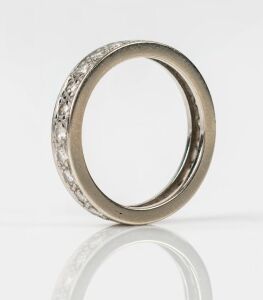 A white gold and brilliant cut diamond eternity ring, 2.4 grams total
