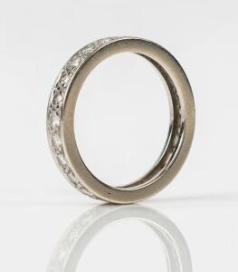 A white gold and brilliant cut diamond eternity ring, ​​​​​​​2.4 grams total