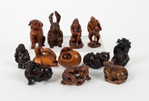 Twelve assorted Japanese carved boxwood netsuke, 20th century, the largest 8cm high