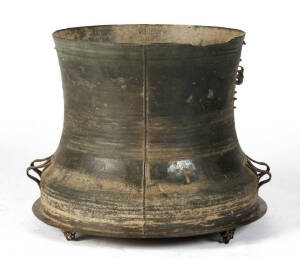 A South-East Asian bronze rain drum, the top mounted with four stylised frogs & with a cast geometric design, probably 1st half 20th century, 44cm high & 59.5cm diameter