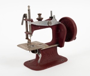 A vintage miniature sewing machine, mid 20th century, 17cm high