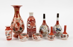 KUTANI ware Japanese porcelain sake bottle, two pairs of vases, pair of pinch bowls, baluster vase adorned with figures, and a miniature vase, Meiji period, 19th/20th century, (9 items), the largest 20.5cm high