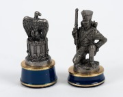 The Battle of Waterloo Chess Set, by Franklin Mint, 1987, 32 pewter chessmen on red and blue enamelled pedestals; the pewter-finished playing area with timber case. The top of the chess board lifts to reveal separate storage compartments for each of the t - 2