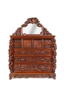 A magnificent Japanese reddish brown lacquered four-piece bedroom suite, early 20th century, comprised of a single bed, a chest, a dressing table, and a wardrobe on stand, all carved and pierced in high relief with dragon design and exotic flowers. bed: 1