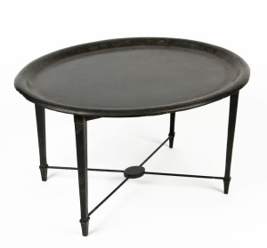 An oval papier-mâché topped tray stand table, 45cm high, 77cm wide, 63cm deep