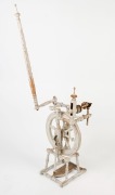 An antique turned beech spinning wheel with remains of white painted finish, 19th century, ​​​​​​​144cm high - 2