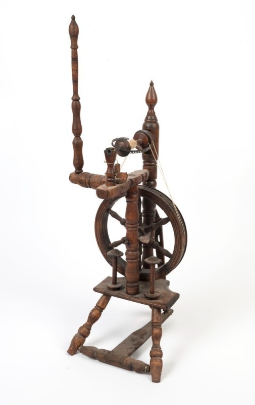 An antique turned and stained beech parlour spinning wheel, 19th century, ​​​​​​​107cm high