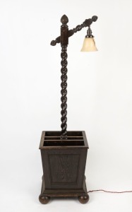 A Jacobean revival stained oak standard lamp with barley twist column and storage box base, circa 1920s, 152cm high