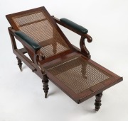 An antique English mahogany reclining library chair, caned frame with dark green leather upholstered diamond button cushions, scroll arms, ring turned feet and original brass castors, circa 1840, 94cm high, 62cm across the arms - 2