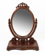 An antique English mahogany dressing mirror, serpentine plinth base with scroll feet, oval mirror with well carved supports, 19th century, ​​​​​​​93cm high, 66cm wide, 29cm deep