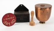 A vintage metal telephone tin, enamel bread sign, copper cannister and butter press, 19th and 20th century, (4 items), the cannister 14cm high