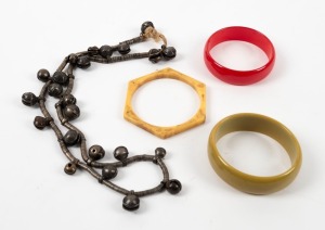 Three vintage bakelite and plastic bangles, plus a tribal silver bell bead necklace, 20th century, (4 items)