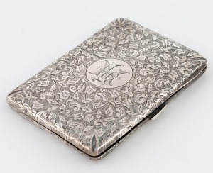 An antique sterling silver cigarette case with engraved foliate decoration and monogram cartouche, 19th century, 10cm wide, 70 grams