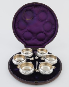 A set of six antique English sterling silver salts with beaded decoration and floral engraving, with spoons and in original plush lined box, London, circa 1875, 222 grams overall