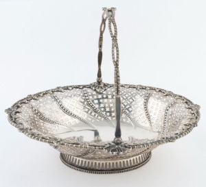 A reproduction Georgian style English sterling silver pierced basket by Mappin & Webb, 20th century, 28cm high, 36cm wide, 1350 grams