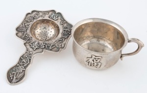 An antique Chinese export silver teacup and tea strainer, 19th/20th century, (2 items), the strainer 15cm long, 146 grams total