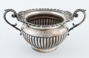 An antique English sterling silver sugar basin, made in Sheffield, circa 1897, ​​​​​​​9cm high, 18cm wide, 280 grams