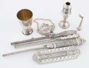 JUDAICA group of seven assorted silver items including kiddush cup, wine label, mezuzah case,&nbsp;spice tower, and three candle lighters, 20th century, the largest 33cm long, 450 grams total