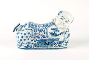 Two Chinese blue and whiteporcelain boy pillows, 17 and 18cm high