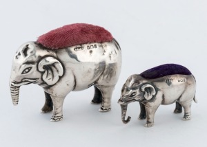 Two antique English sterling silver elephant pin cushions, the larger 5.5cm high, 7cm long