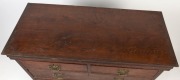 An antique English George III oak chest of five drawers, quarter turned column decoration standing on ogee feet with Chippendale plate handles, pine secondary timbers, circa 1780, ​​​​​​​most likely the top of a chest-on-chest, 99cm high, 110cm wide, 52cm - 2