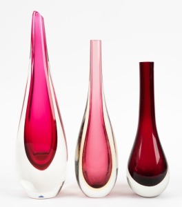 Three red sommerso Murano glass stem vases, the largest 31.5cm high.