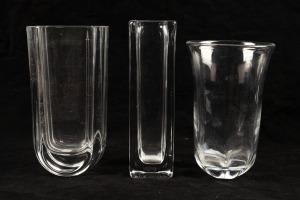 Three Scandinavian clear glass vases, two by ORREFORS, the other KOSTA BODA, all signed to base, ​​​​​​​the largest 23cm high.