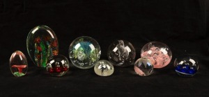 Group of nine assorted art glass paperweights, 20th century, the largest 13cm high