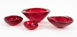 Four Murano ruby glass bowls, all bearing original foil labels, ​​​​​​​the largest 17cm wide.