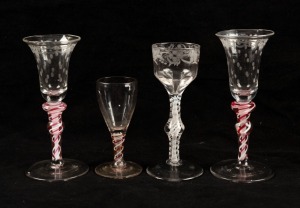 Four assorted air twist stem glasses with engraved decoration in the Georgian manner, 20th century, the largest 15.5cm high