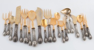 A fine suite of antique Russian silver handled serving utensils with gilt finish, late 19th century, (21 pieces)