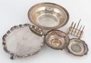 Sterling silver salver, pierced silver bowl, sterling silver dish with silver coin, sterling silver toast rack and serving bowl, 19th/20th century, (5 items), the largest 23cm diameter, 760 grams total