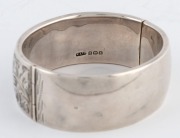 An antique sterling silver bangle with engraved decoration, made in Birmingham, circa 1922 - 2