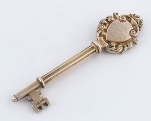 A presentation sterling silver key, engraved "Presented to LADY VIOLET ASTOR On Opening The Paton Home, Lingfield, Colony, 6 Nov., 1931", 10.5cm long, 38 grams